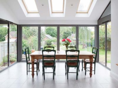 light grey bi-folding doors in a domestic dining room environment
