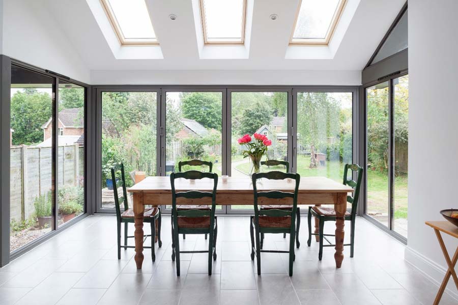 light grey bi-folding doors in a domestic dining room environment