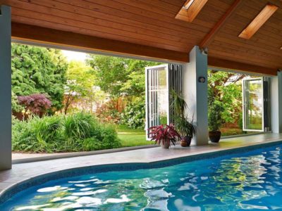 smarts visofold 1000 doors opening up a swimming pool area into a large garden