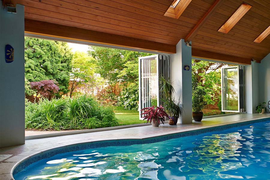 smarts visofold 1000 doors opening up a swimming pool area into a large garden