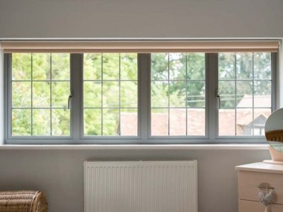 OW 70 Aluminium Casement window in grey with roller blind