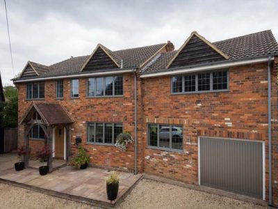 Zoomed out shot of home installed with OW-70 Aluminium Casement windows